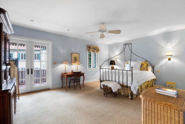 carpeted bedroom with ceiling fan, french doors, and access to outside