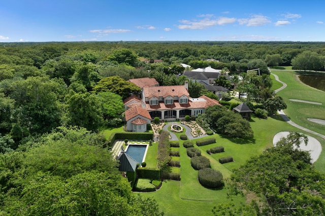 birds eye view of property featuring a view of trees