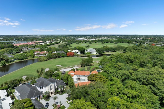 birds eye view of property featuring view of golf course and a water view