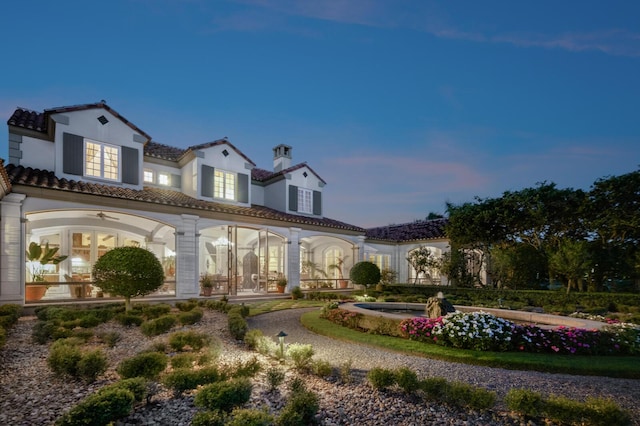 view of front of home featuring a tile roof