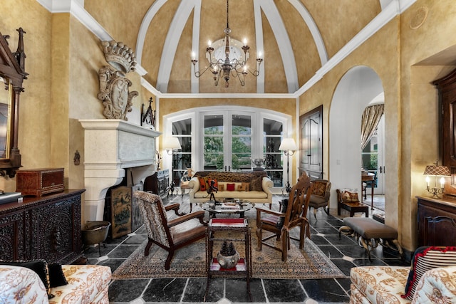 living room with high vaulted ceiling, a chandelier, and dark tile floors