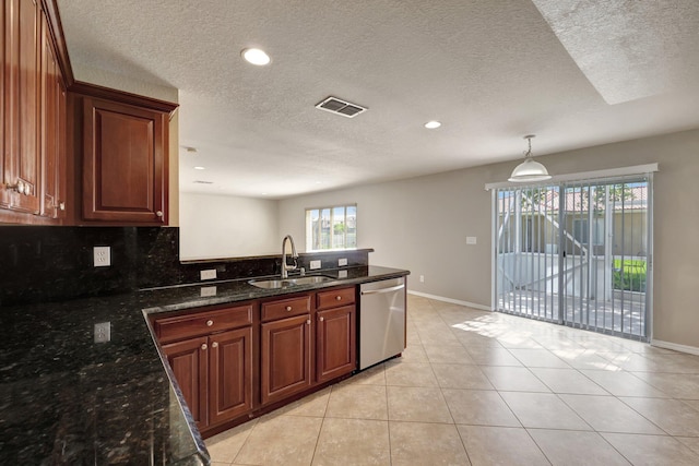 kitchen with visible vents, dishwasher, light tile patterned floors, a peninsula, and a sink