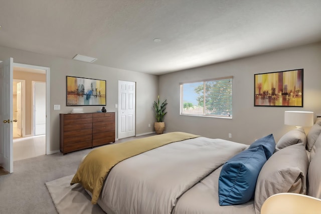 bedroom featuring light carpet