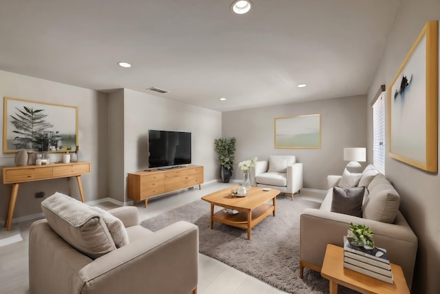 living room with visible vents, recessed lighting, and baseboards