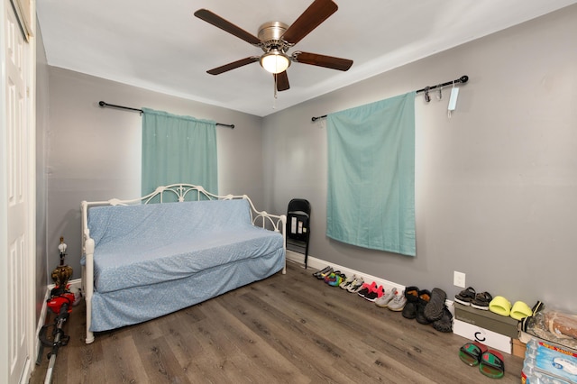 bedroom with hardwood / wood-style floors and ceiling fan