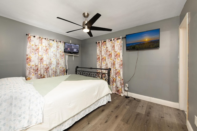 bedroom featuring ceiling fan and hardwood / wood-style flooring