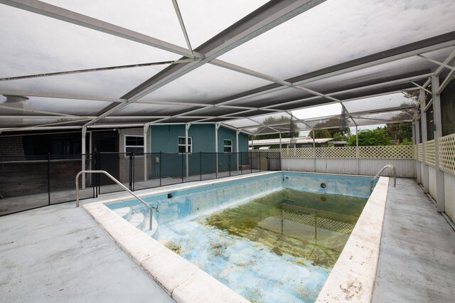 view of pool featuring a lanai