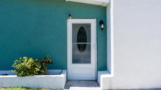 1013 Hispana Ave, Fort Pierce, FL 34982 - view of exterior entry with stucco siding
