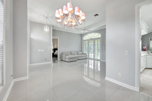 living room featuring ceiling fan with notable chandelier, light tile patterned floors, and crown molding