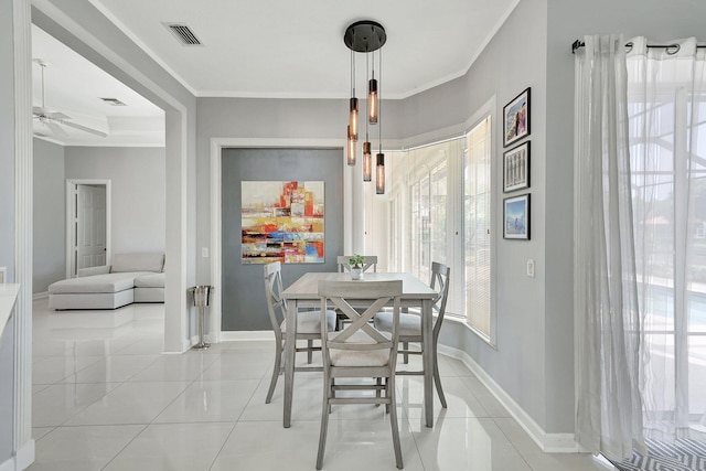 dining space featuring crown molding, light tile patterned floors, and ceiling fan