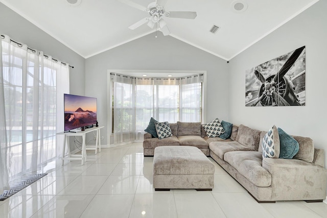 tiled living room with crown molding, ceiling fan, and a healthy amount of sunlight