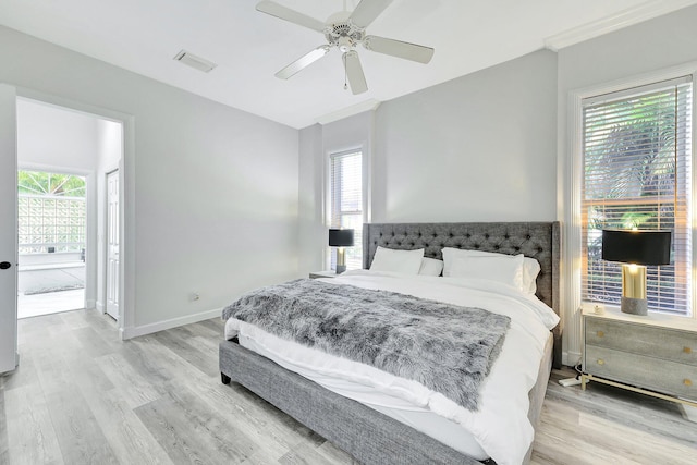 bedroom featuring light hardwood / wood-style flooring and ceiling fan