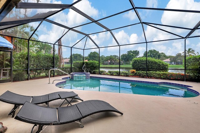 view of pool featuring an in ground hot tub, a patio, and a lanai