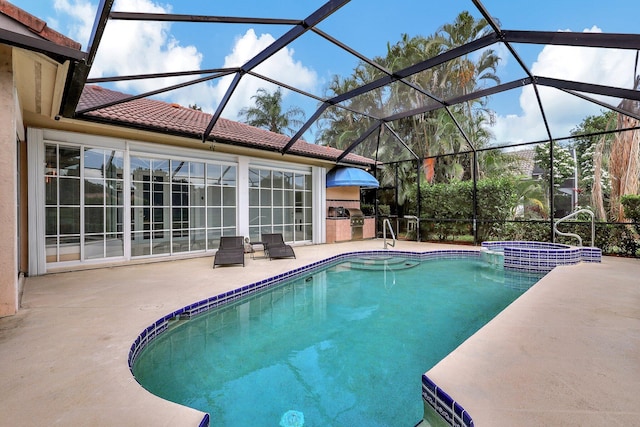 view of swimming pool featuring a patio and a lanai