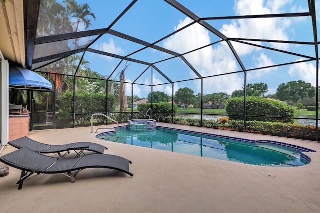 view of swimming pool with a patio, a pool with connected hot tub, and glass enclosure