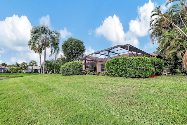 view of yard with a lanai