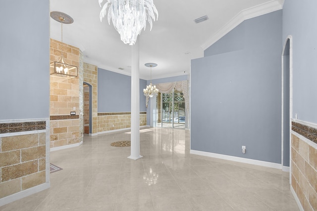 spare room featuring crown molding and a chandelier