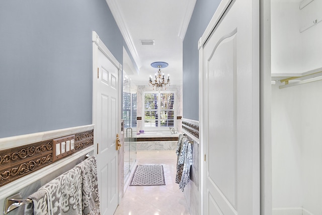 bathroom with tile patterned floors, independent shower and bath, a chandelier, and ornamental molding