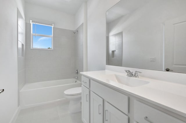 full bathroom with tile patterned flooring, vanity, toilet, and tiled shower / bath