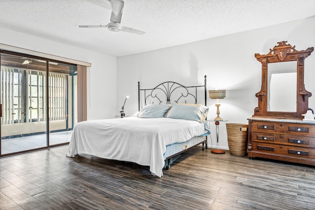 bedroom featuring a textured ceiling, dark hardwood / wood-style floors, ceiling fan, and access to exterior