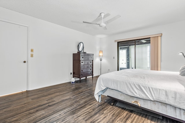 bedroom featuring ceiling fan, access to exterior, and dark wood-type flooring