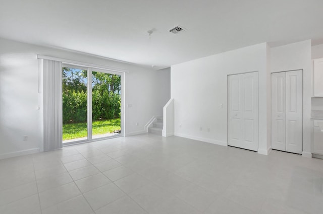 empty room with light tile patterned floors