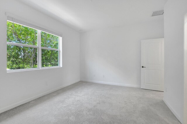 empty room with light colored carpet