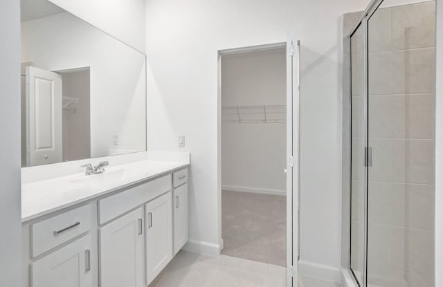 bathroom featuring vanity and walk in shower