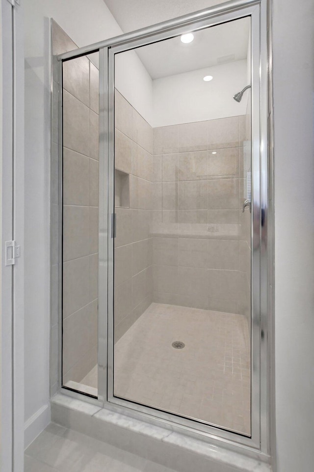 bathroom featuring tile patterned flooring and walk in shower