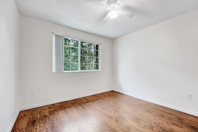 empty room featuring hardwood / wood-style floors, a textured ceiling, and ceiling fan