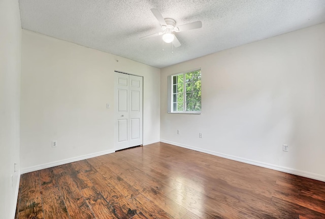 unfurnished room featuring ceiling fan, a textured ceiling, and hardwood / wood-style floors