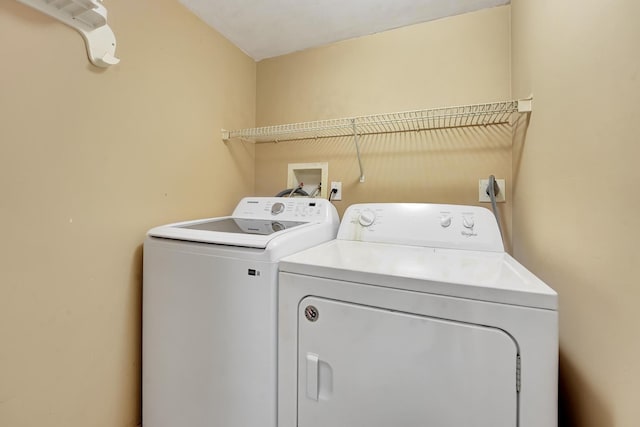 laundry area with washer and clothes dryer