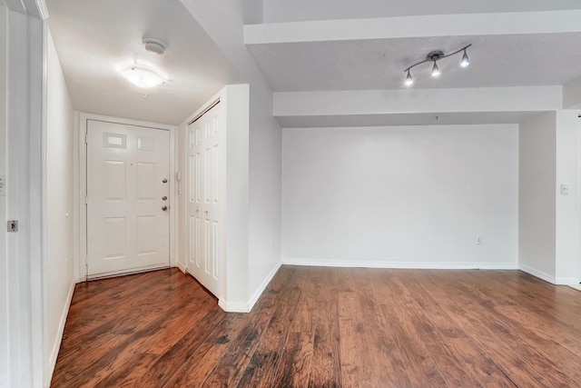 foyer featuring dark wood-type flooring