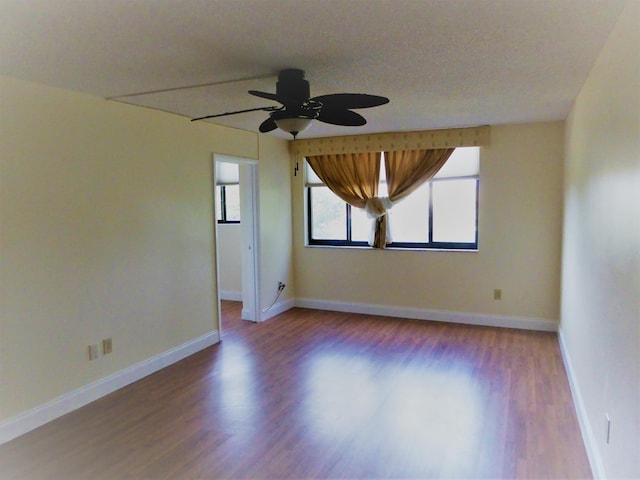 unfurnished room featuring ceiling fan and hardwood / wood-style flooring