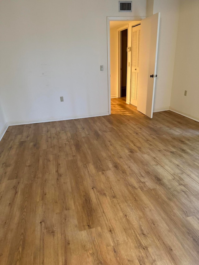 spare room with light hardwood / wood-style floors