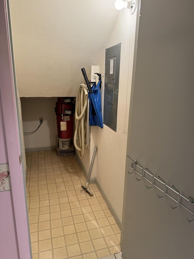 interior space featuring tile patterned flooring and electric panel