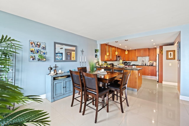 dining area with light tile patterned floors