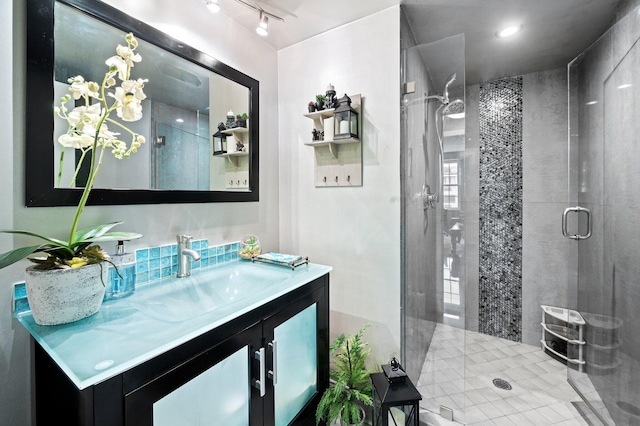 bathroom with vanity and an enclosed shower