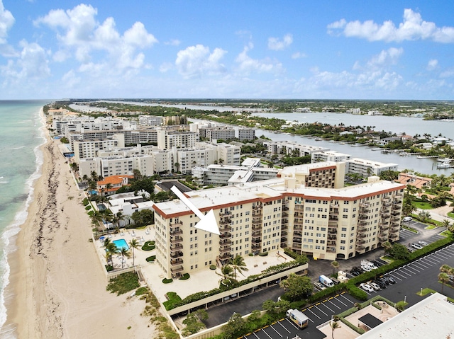 aerial view featuring a view of the beach and a water view