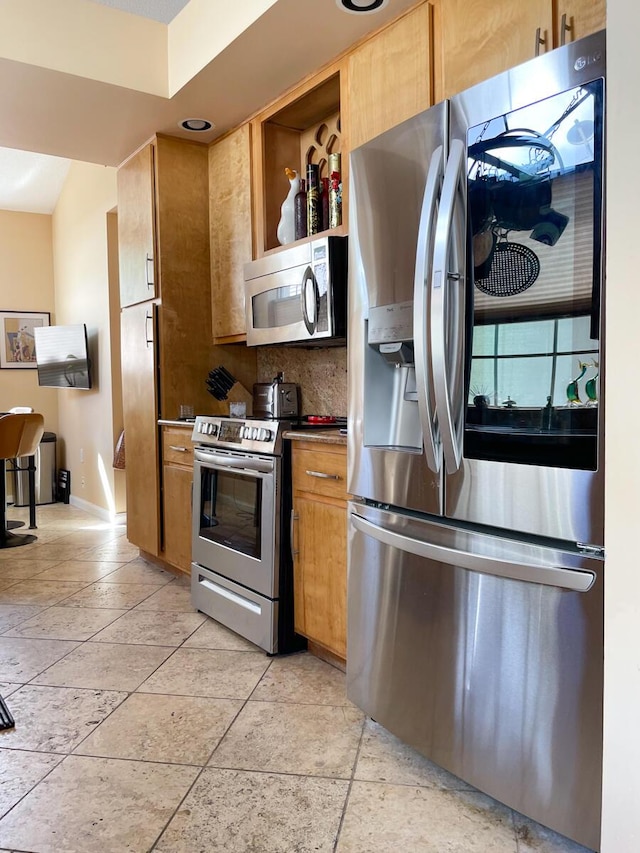 kitchen with decorative backsplash and stainless steel appliances