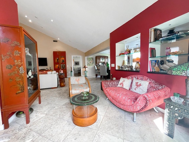 living room featuring vaulted ceiling