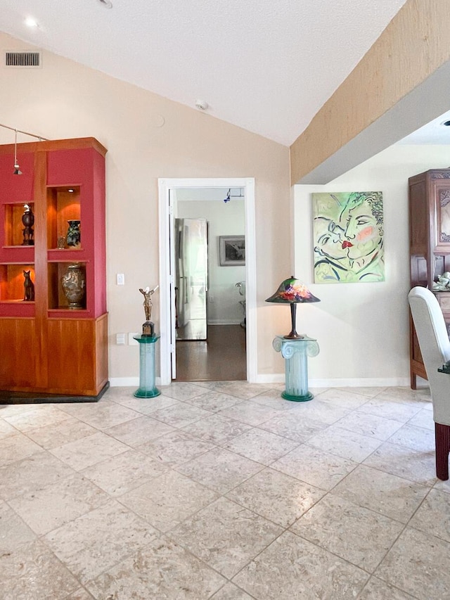 interior space featuring lofted ceiling