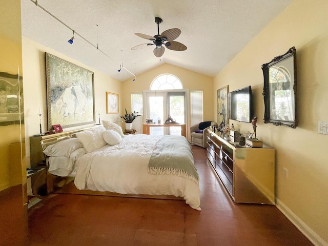 bedroom featuring a textured ceiling, ceiling fan, and lofted ceiling