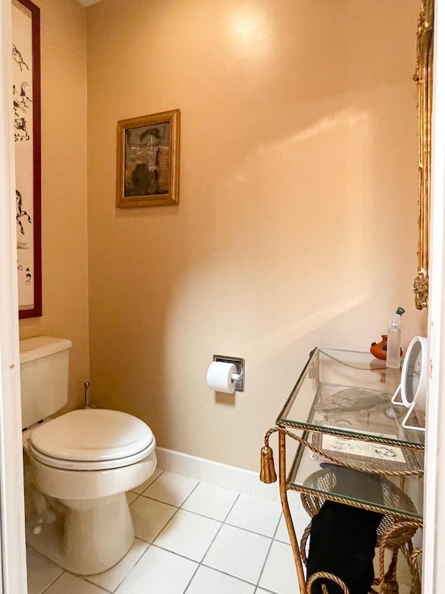 bathroom featuring toilet and tile patterned floors