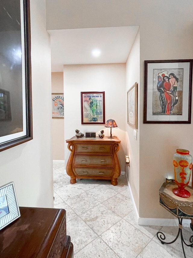 hallway featuring light tile patterned floors