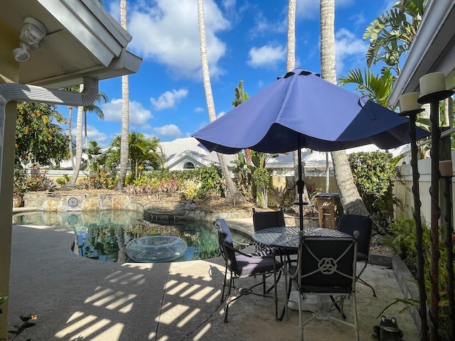 view of patio / terrace with a fenced in pool