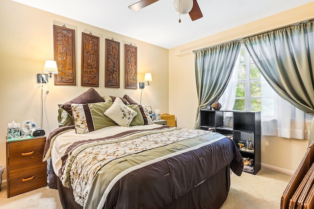 bedroom with ceiling fan and carpet flooring