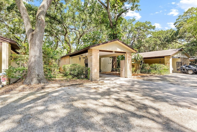 view of front of property with a carport