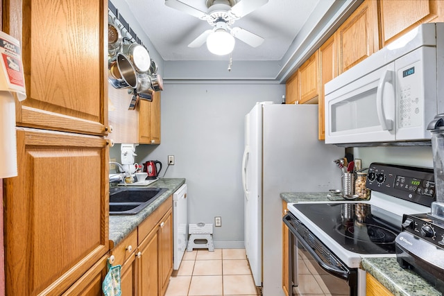 kitchen with ceiling fan, sink, white appliances, and light tile floors