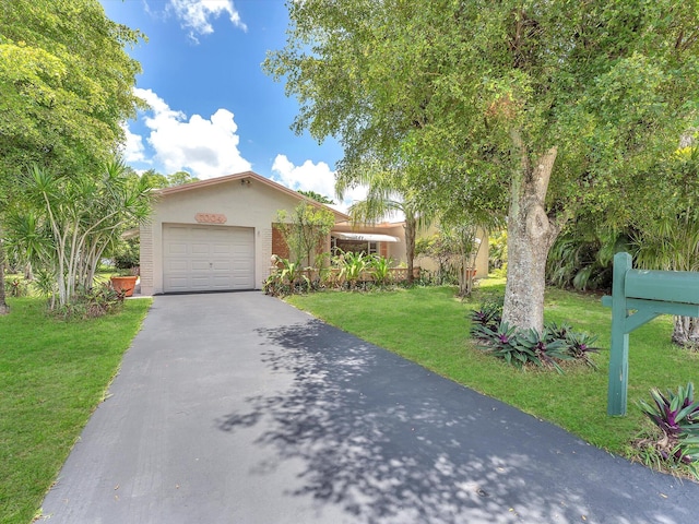 view of front facade with a front lawn and a garage